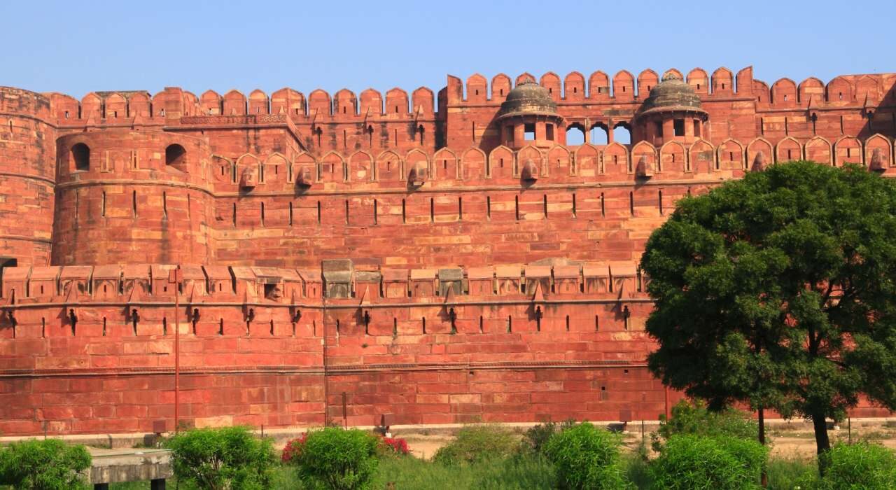 Taj Mahal and Agra Fort half day tour with tourists exploring monuments